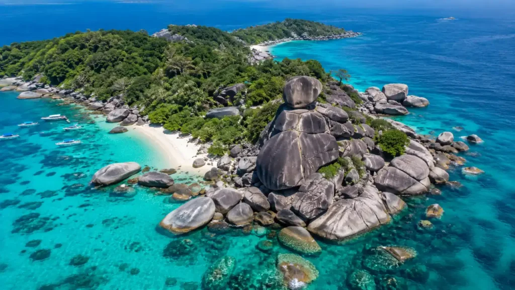 Aerial view of the Similan Islands with granite boulders, white sand beaches, and crystal-clear water in Southern Thailand.